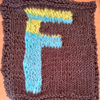 Grey square with blue and green letter F