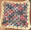 Mottled blues and pinks, with a cream border