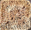 solid granny square in blue/red/beige colour changing yarn
