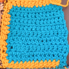 bright blue square with yellow border on three sides