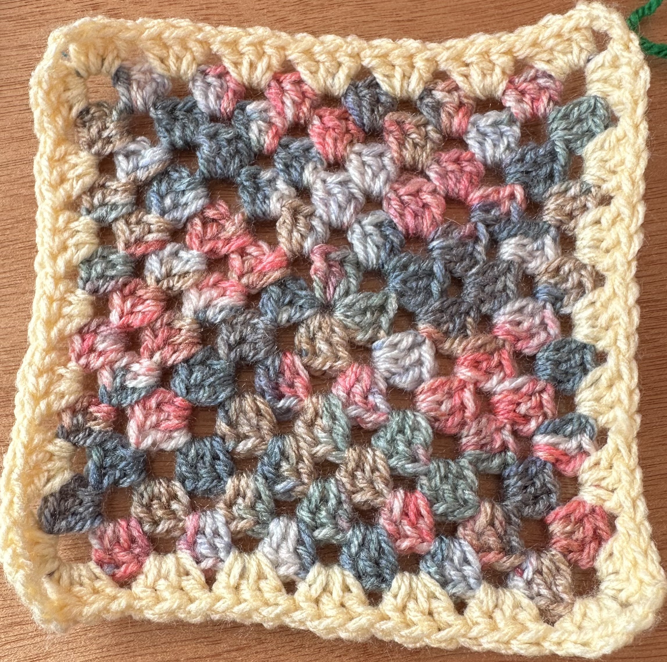 Mottled blues and pinks, with a cream border