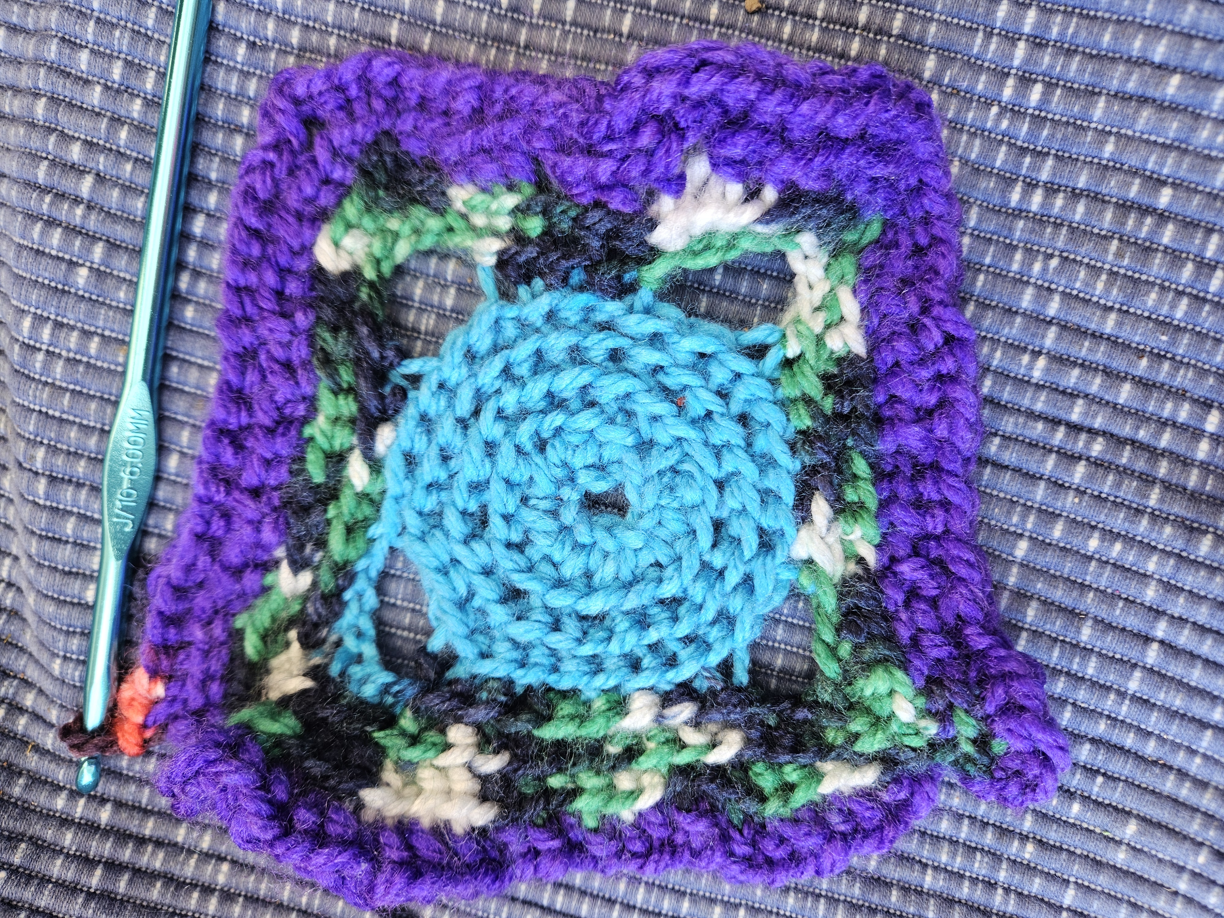 Blue center, greens, and purple edge