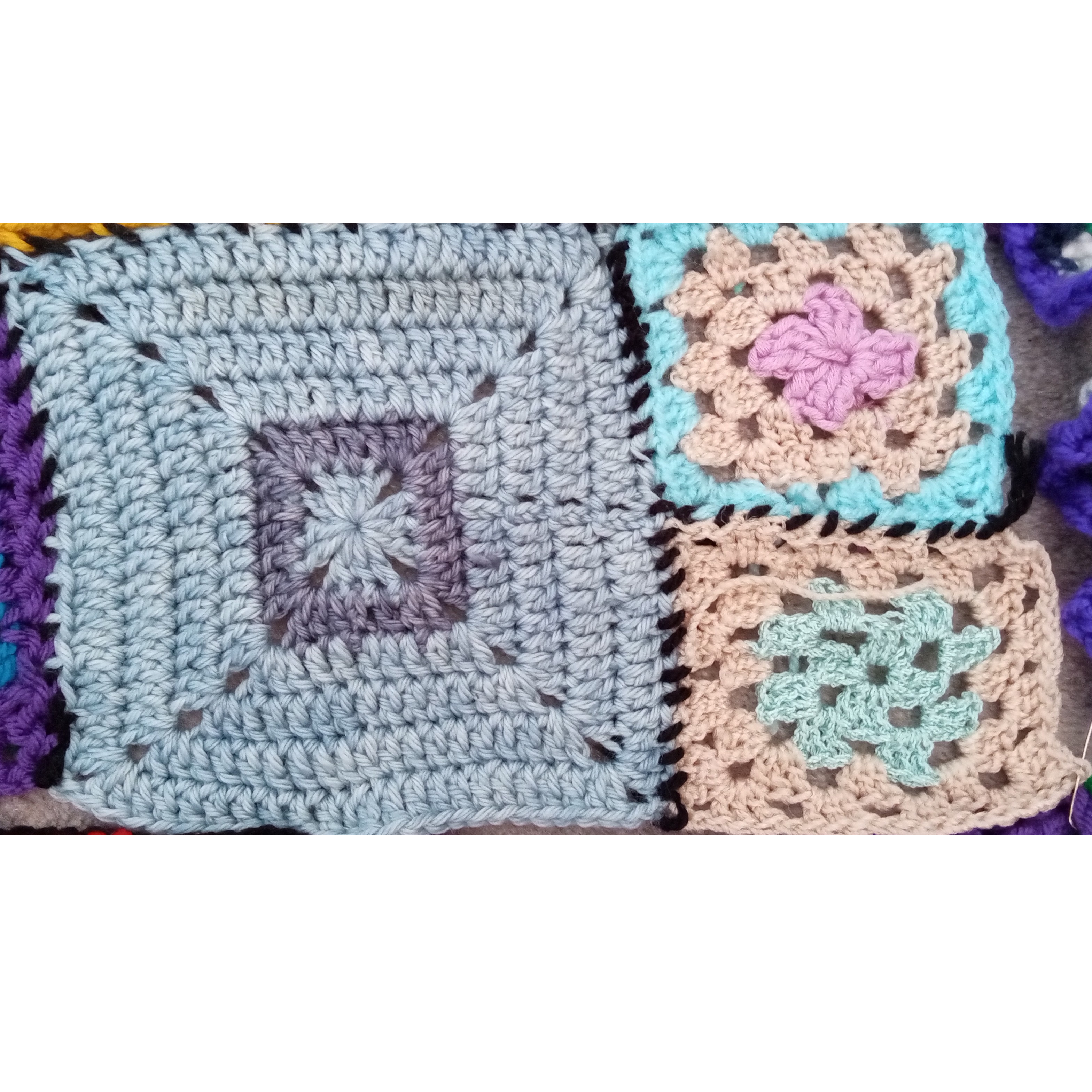 3 squares: one light blue square with dark blue ring, two quarter-size squares in turquoise, cream, and pink