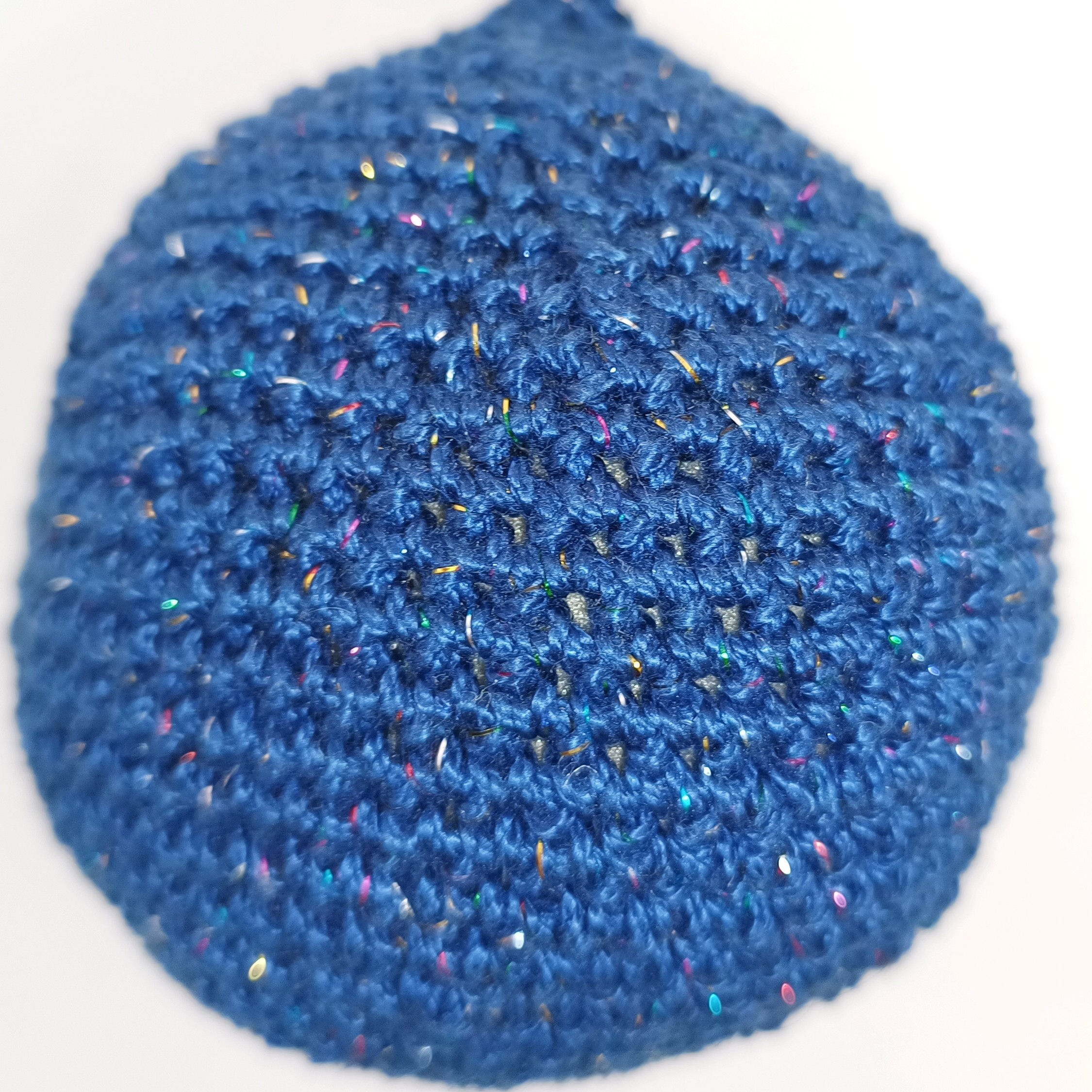 A dark blue planet with rainbow glitters.